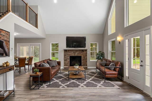 21 Wilde Gln, Albrightsville, PA 18210 - living room featuring high vaulted ceiling, wood finished floors, and a stone fireplace