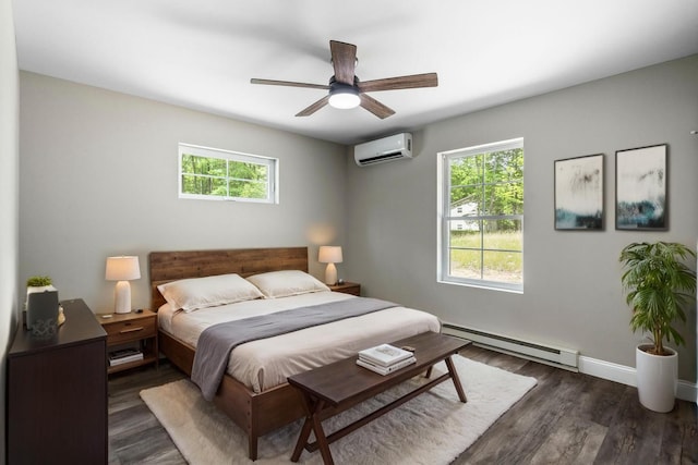 21 Wilde Gln, Albrightsville, PA 18210 - bedroom featuring baseboard heating, a wall mounted AC, multiple windows, and wood finished floors