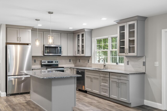 21 Wilde Gln, Albrightsville, PA 18210 - kitchen featuring stainless steel appliances, gray cabinets, light stone countertops, backsplash, and light wood-style floors
