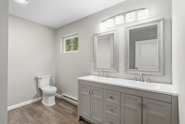 21 Wilde Gln, Albrightsville, PA 18210 - bathroom featuring a baseboard heating unit, double vanity, and wood finished floors