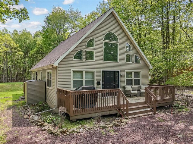 186 Brier Crest Rd, Blakeslee, PA 18610 - back of house with a deck, roof with shingles, and a view of trees