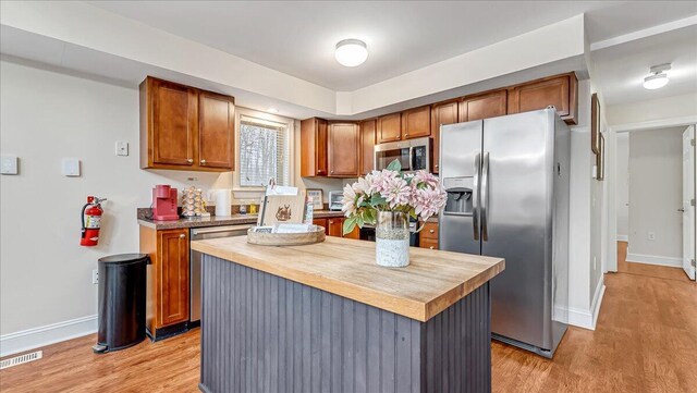 186 Brier Crest Rd, Blakeslee, PA 18610 - kitchen featuring stainless steel appliances, wooden counters, light wood-style flooring, and baseboards