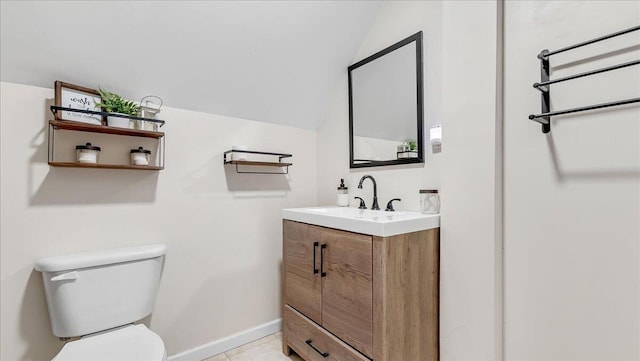 186 Brier Crest Rd, Blakeslee, PA 18610 - bathroom with toilet, vanity, vaulted ceiling, and baseboards
