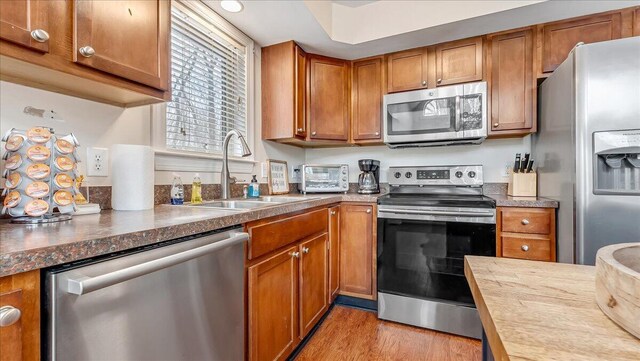 186 Brier Crest Rd, Blakeslee, PA 18610 - kitchen featuring stainless steel appliances, a sink, and brown cabinetry