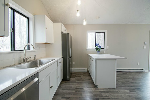 kitchen featuring a sink, a baseboard heating unit, dark wood-type flooring, appliances with stainless steel finishes, and baseboard heating