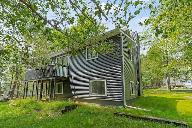 back of property featuring a lawn