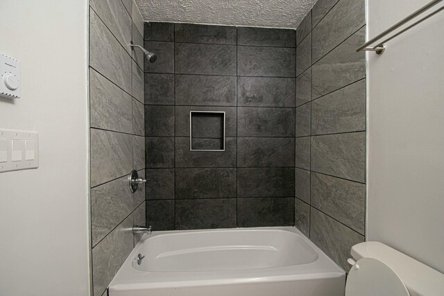 bathroom featuring toilet and bathing tub / shower combination