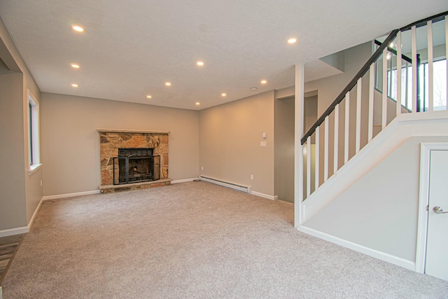 unfurnished living room featuring recessed lighting, stairway, a baseboard heating unit, baseboards, and carpet flooring