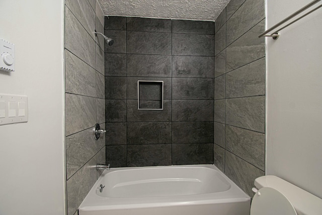 bathroom featuring toilet and bathtub / shower combination