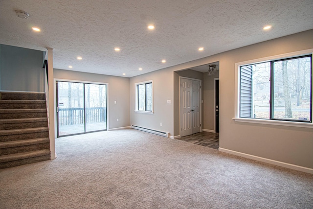 unfurnished living room with baseboards, recessed lighting, baseboard heating, stairway, and carpet floors