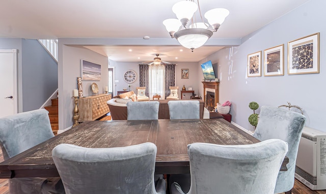 6435 Marvin Gdns, Tobyhanna, PA 18466 - dining space featuring stairs, a chandelier, a ceiling fan, wood finished floors, and baseboards