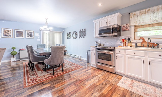 6435 Marvin Gdns, Tobyhanna, PA 18466 - kitchen featuring a sink, appliances with stainless steel finishes, a baseboard radiator, a chandelier, and light wood-style floors