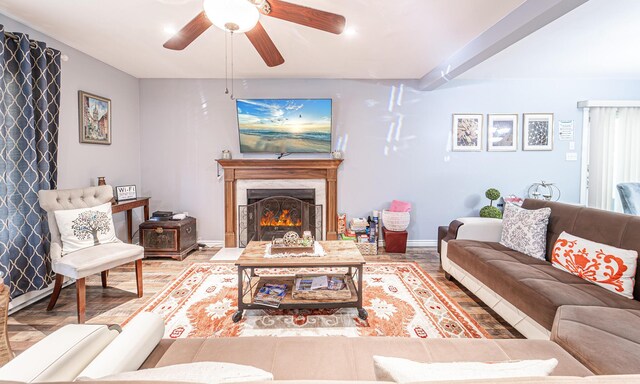 6435 Marvin Gdns, Tobyhanna, PA 18466 - living area featuring a ceiling fan, baseboards, a warm lit fireplace, and wood finished floors