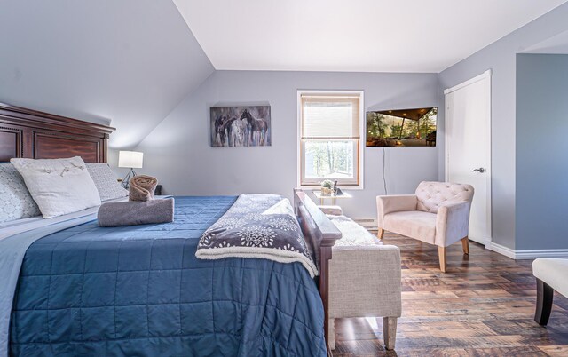 6435 Marvin Gdns, Tobyhanna, PA 18466 - bedroom with dark wood-type flooring, a baseboard radiator, baseboards, and vaulted ceiling