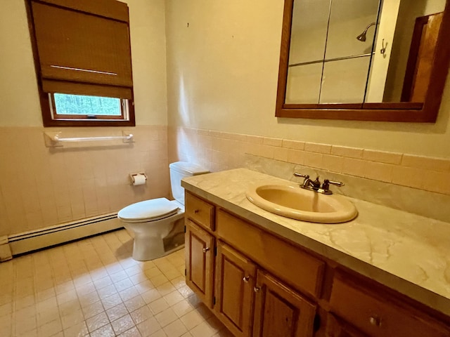 125 Ponder Ln, Scotrun, PA 18355 - bathroom featuring a baseboard radiator, tile walls, vanity, toilet, and wainscoting
