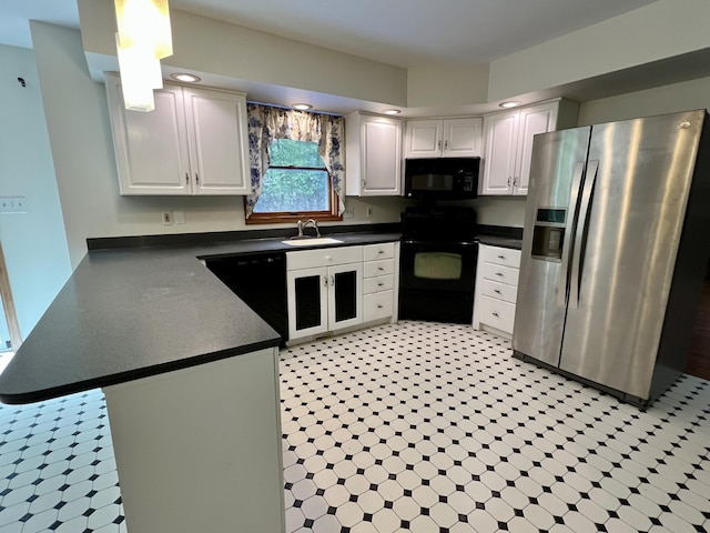 125 Ponder Ln, Scotrun, PA 18355 - kitchen featuring black appliances, a sink, dark countertops, and white cabinets