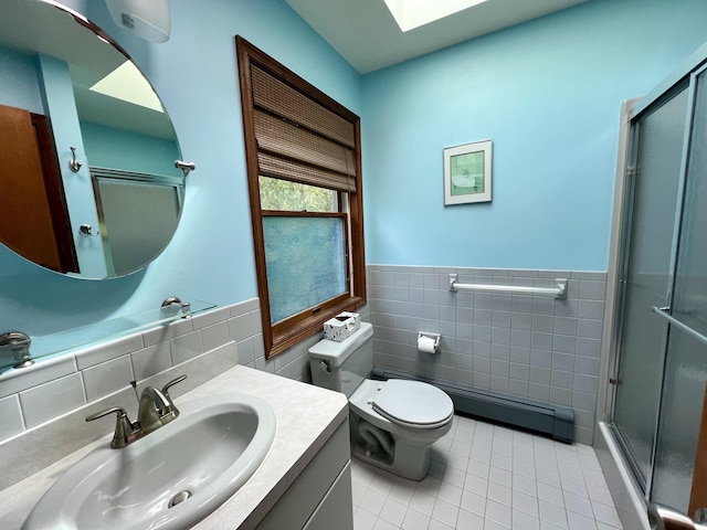 125 Ponder Ln, Scotrun, PA 18355 - bathroom with tile walls, tile patterned floors, a shower stall, vanity, and toilet