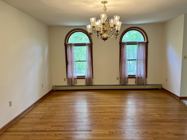 125 Ponder Ln, Scotrun, PA 18355 - unfurnished room featuring a chandelier, wood finished floors, and baseboards