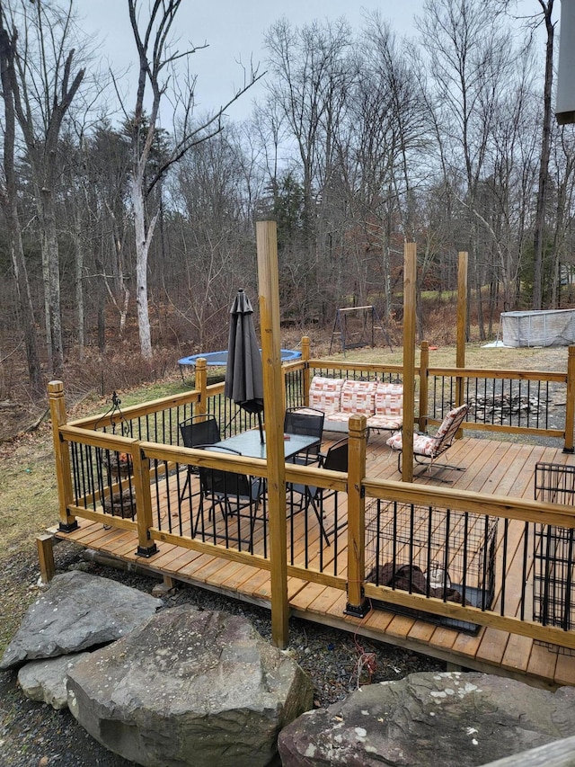 deck featuring outdoor dining area