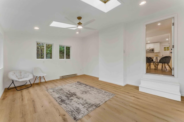 19 Mckinley Ln, Albrightsville, PA 18210 - sitting room with a skylight, a baseboard heating unit, wood finished floors, recessed lighting, and baseboards