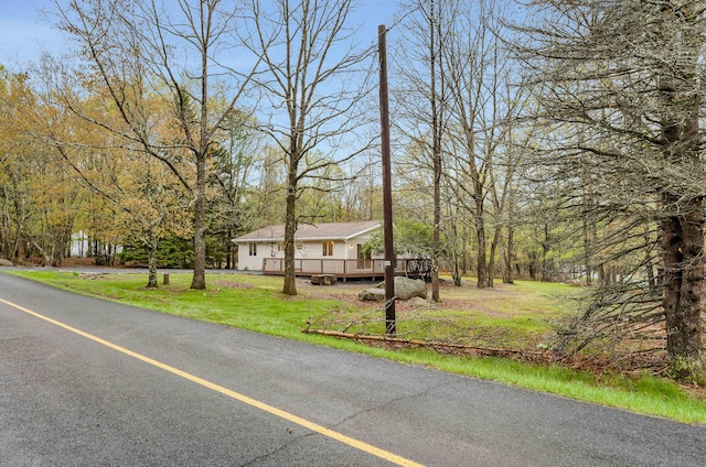 19 Mckinley Ln, Albrightsville, PA 18210 - view of front of property with a wooden deck and a front yard