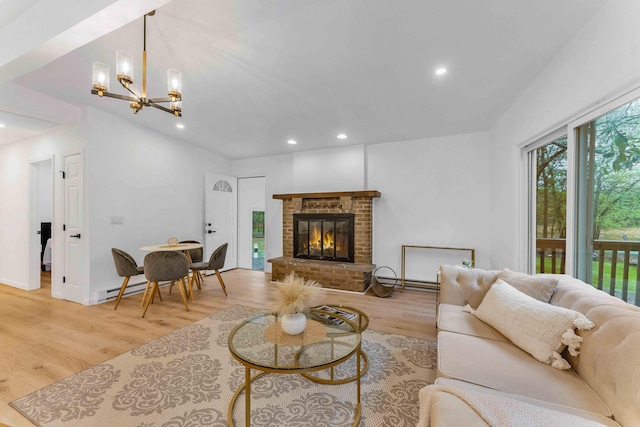 19 Mckinley Ln, Albrightsville, PA 18210 - living area featuring light wood-style floors, recessed lighting, a chandelier, a brick fireplace, and a baseboard heating unit