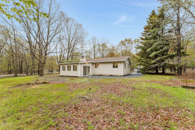 19 Mckinley Ln, Albrightsville, PA 18210 - back of house with a chimney and a lawn