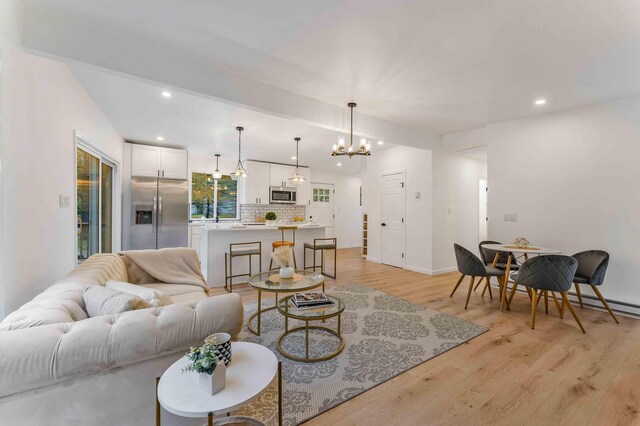 19 Mckinley Ln, Albrightsville, PA 18210 - living area featuring light wood-type flooring, recessed lighting, a chandelier, and baseboards
