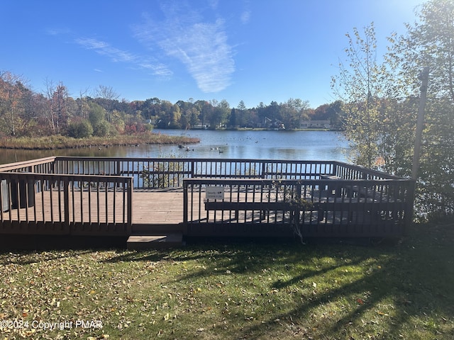 dock area featuring a deck with water view