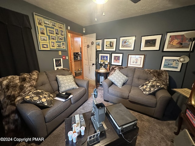 carpeted living room featuring a textured ceiling and ceiling fan