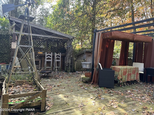 exterior space with a fire pit and a deck