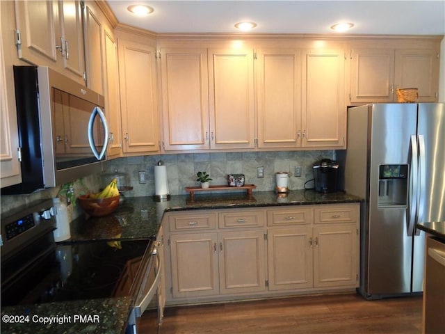144 Dogwood Dr, Jim Thorpe, PA 18229 - kitchen featuring stainless steel appliances, dark wood-style flooring, dark stone counters, and decorative backsplash