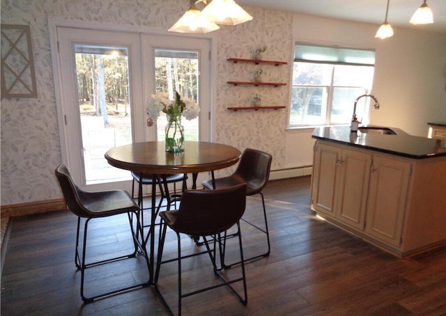 144 Dogwood Dr, Jim Thorpe, PA 18229 - dining area featuring wallpapered walls, dark wood-style flooring, a baseboard radiator, and healthy amount of natural light
