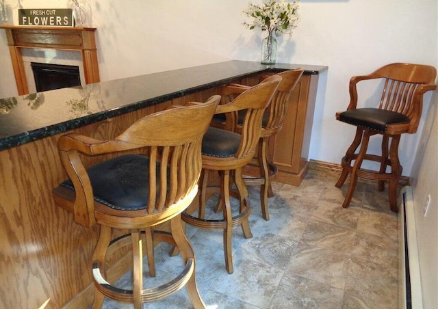 144 Dogwood Dr, Jim Thorpe, PA 18229 - indoor dry bar featuring stone finish floors and baseboards