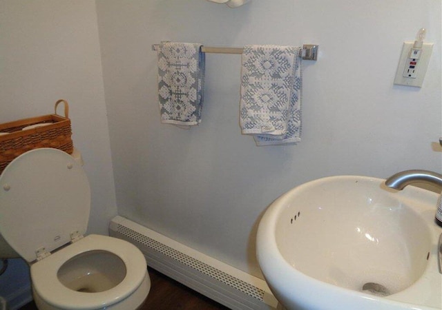 144 Dogwood Dr, Jim Thorpe, PA 18229 - bathroom with a sink, a baseboard heating unit, and toilet