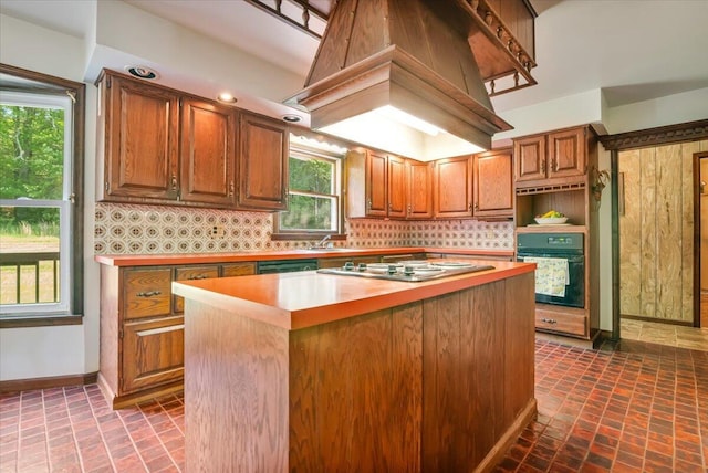 1163 Bush Rd, Cresco, PA 18326 - kitchen featuring oven, tasteful backsplash, stainless steel cooktop, baseboards, and a center island