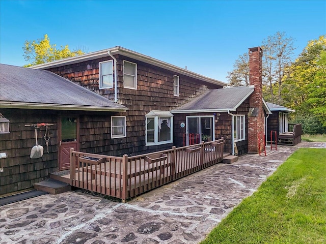 1163 Bush Rd, Cresco, PA 18326 - back of house featuring a chimney, a wooden deck, a shingled roof, and a patio area