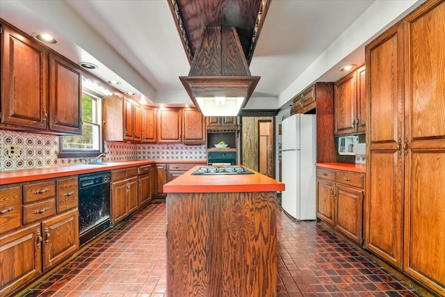 1163 Bush Rd, Cresco, PA 18326 - kitchen with appliances with stainless steel finishes, decorative backsplash, brown cabinets, a kitchen island, and light countertops