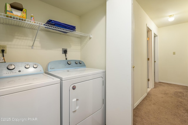 washroom featuring independent washer and dryer and light carpet