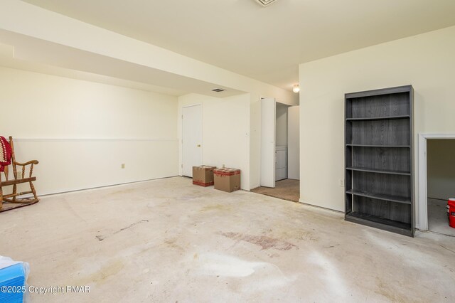 spare room with concrete floors