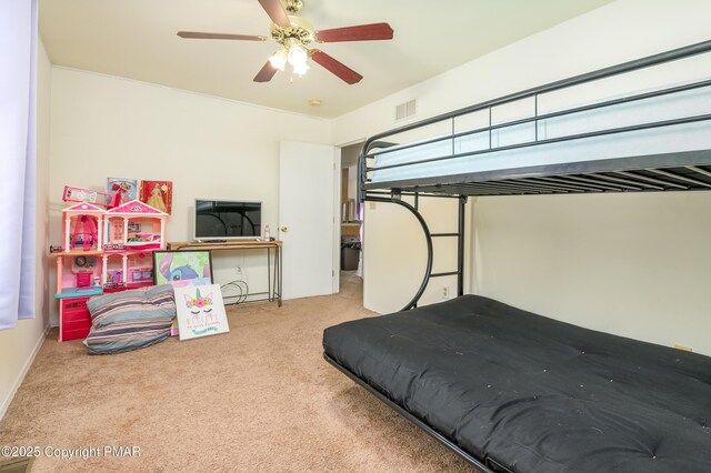 carpeted bedroom featuring ceiling fan