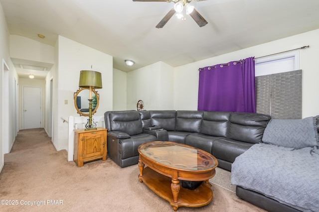 carpeted living room with ceiling fan