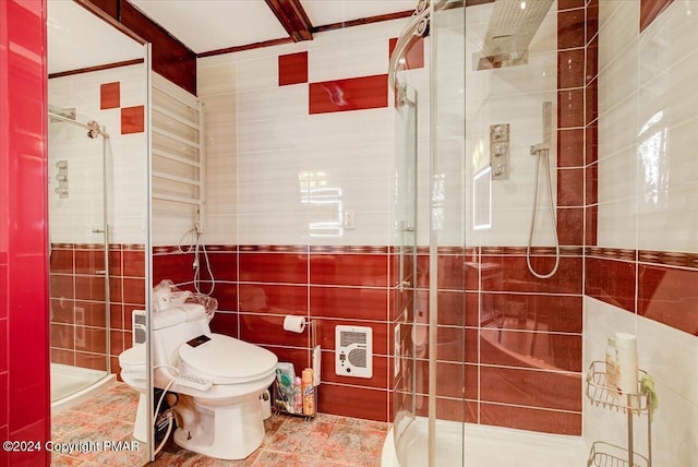 bathroom featuring heating unit, a shower stall, toilet, and tile walls