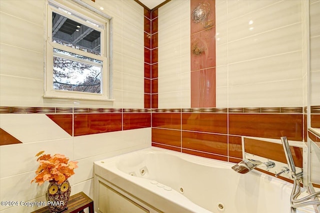 bathroom featuring a whirlpool tub and tile walls