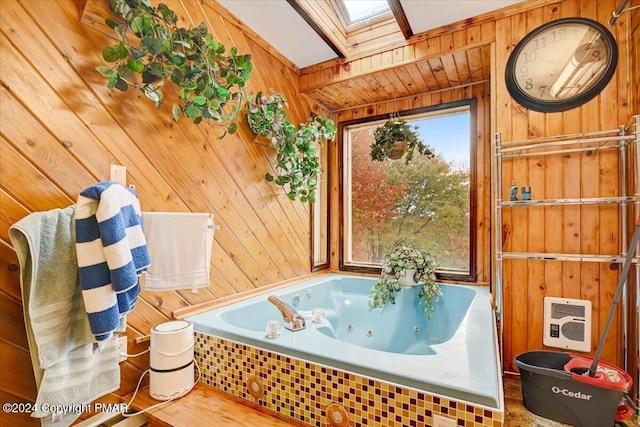 full bathroom with a whirlpool tub, wood walls, a skylight, and heating unit