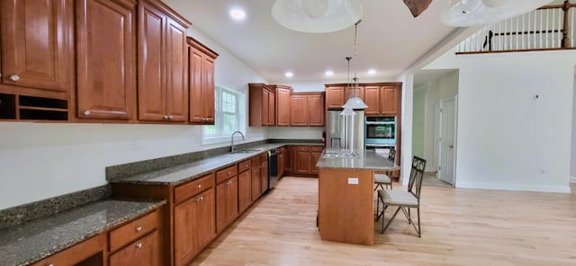 259 Great Bear Way E, Stroudsburg, PA 18302 - kitchen featuring light wood-style floors, a breakfast bar, dark stone countertops, and recessed lighting