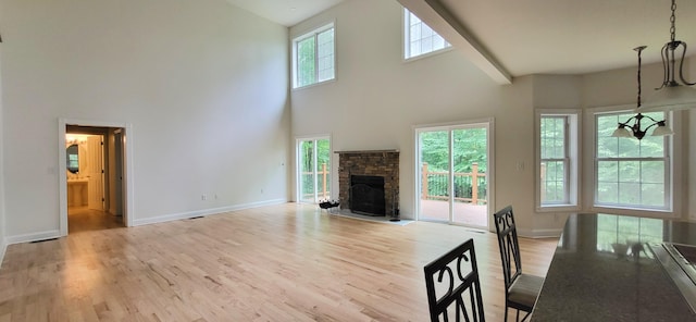 259 Great Bear Way E, Stroudsburg, PA 18302 - living area with a high ceiling, light wood-style floors, and a stone fireplace