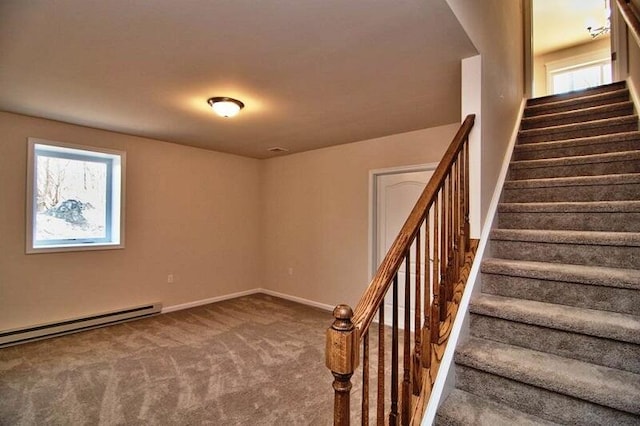 411 Pierce Ln, East Stroudsburg, PA 18301 - stairway with carpet floors, a baseboard heating unit, and baseboards