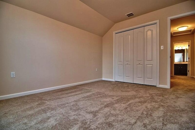 411 Pierce Ln, East Stroudsburg, PA 18301 - unfurnished bedroom with carpet flooring, lofted ceiling, baseboards, and a closet