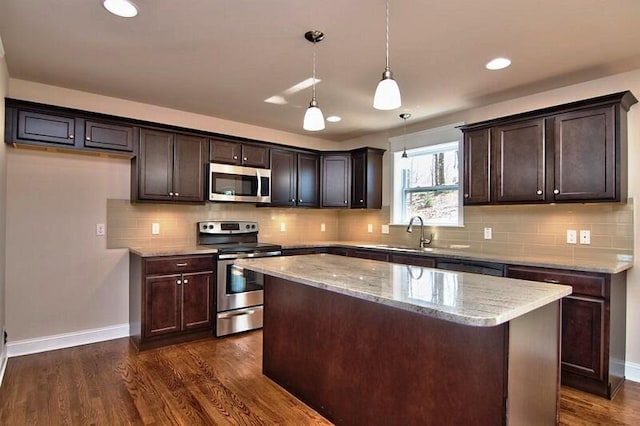 411 Pierce Ln, East Stroudsburg, PA 18301 - kitchen featuring appliances with stainless steel finishes, a sink, dark brown cabinetry, baseboards, and dark wood-style floors